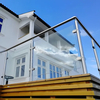 Framed Glass Balustrades with Stainless Steel Round Tubing for Luxurious Villa Balconies